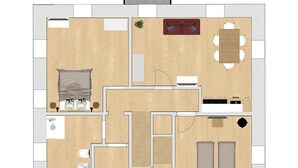 A floor plan with a living room, kitchen, two bedrooms, a bathroom, and a dining area. - Ciesa dela Maestra 2ªB (Rocca Pietore)