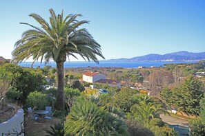 A residential area with a view of the sea and mountains.