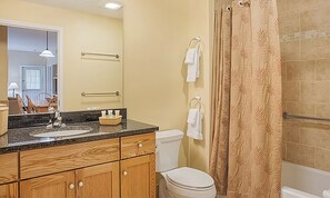 Jetted bath, hair dryer, soap, toilet paper