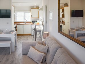 Living area - Lovely modern chalet with stunning sea views on a lovely quiet site. (Bacton)