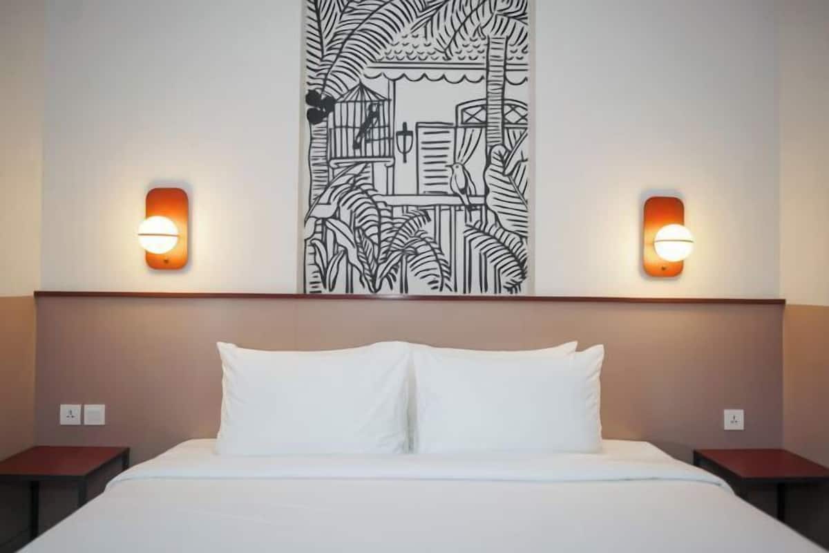 Premium bedding, desk, laptop workspace, blackout drapes