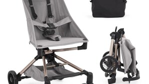 A stroller with a canopy, four wheels, and a carrying bag.