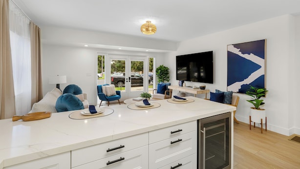 A modern kitchen with a white countertop, built-in appliances, and a large window. - New 2 En Suite Bedrooms, Balboa Park,  Lux, 85" TV, Parking! (San Diego)