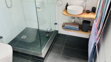 Shower, eco-friendly toiletries, towels, soap