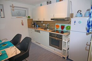 Comfort Apartment, 4 Bedrooms | Private kitchen | Fridge, oven, dishwasher, coffee/tea maker