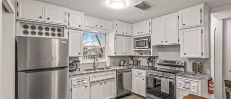 Coffee/tea maker, fridge, microwave, oven