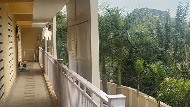 A balcony with a view of a lush green landscape. - Spacious 2BHK Mountain View | Near Palolem Beach (Canacona)
