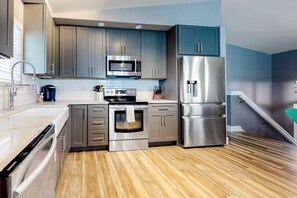 Fridge, microwave, oven, stovetop - Pet-friendly 4BR/3BA home with pool, outdoor bar, grill, and gaming area, steps from the beach! 🏖️ (Port Aransas)