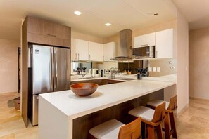 Fridge, coffee/tea maker, cookware/dishes/utensils