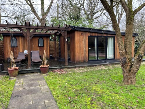 Retreat to a tranquil 30sqm Cedar wood cabin on a 3 acre country estate.