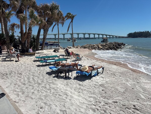 On the beach, sun loungers, beach towels