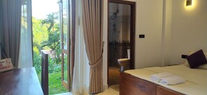 Chambre Double ou avec lits jumeaux, 2 lits une place, patio, vue jardin