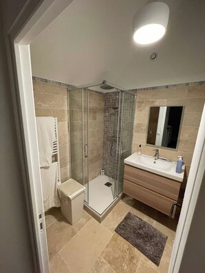 Shower, hair dryer, towels, soap
