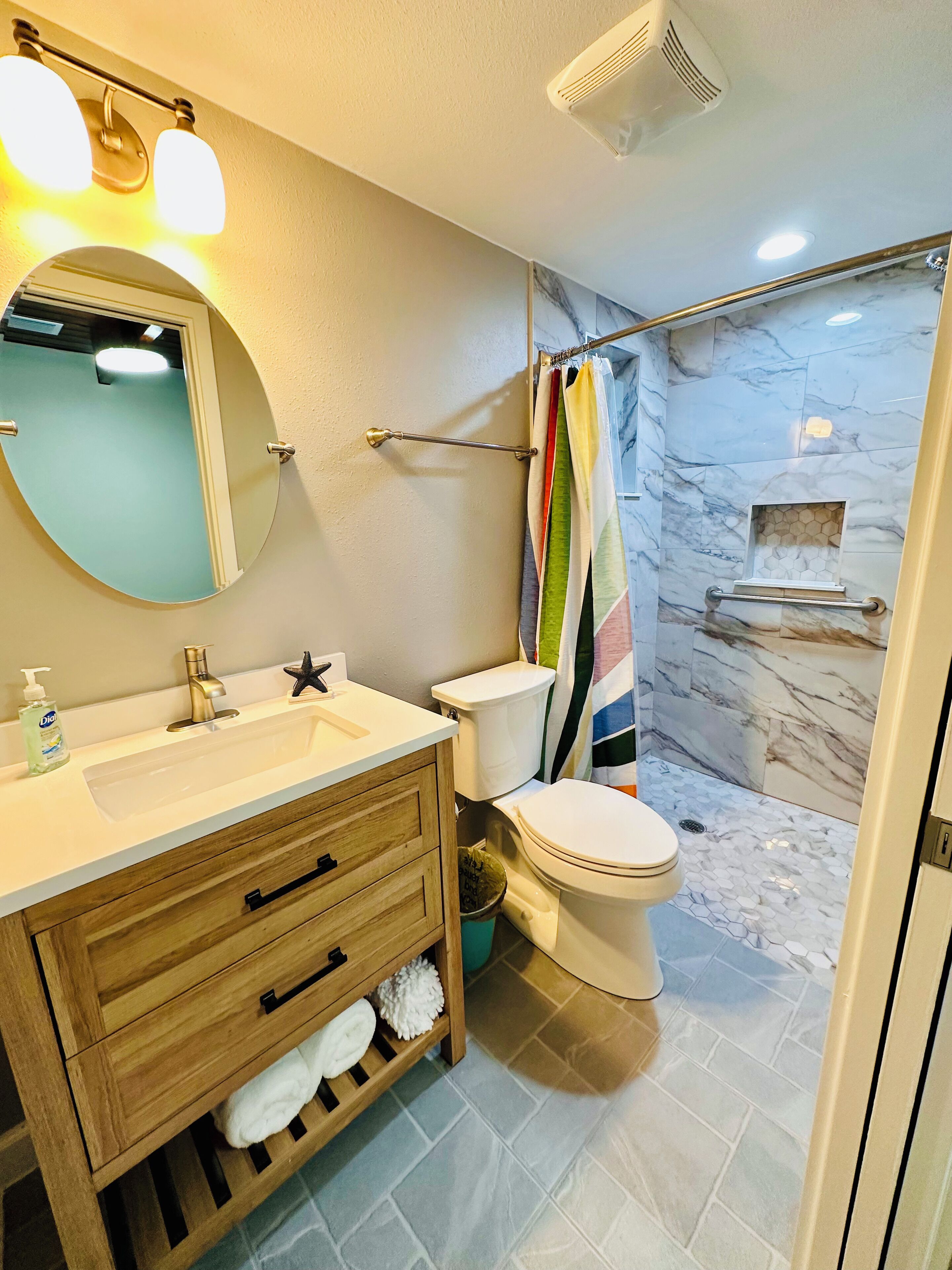 Shower, towels, soap, toilet paper