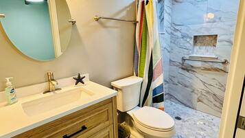 Shower, towels, soap, toilet paper