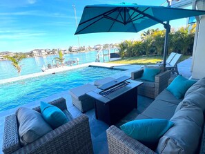 A heated pool - Luxe Waterfront Villa: Pool, Hot Tub, Golf Cart (Indian Rocks Beach)