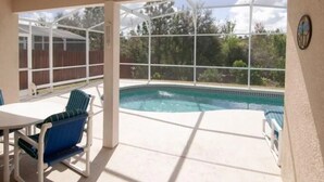A pool area with a sign reading "Sun Seekers Welcome".