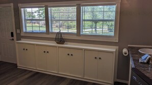 A bathroom with a vanity, a sink, and a window with blinds. - Cozy B- condo in charming Corpus Christi with WiFi, AC near Laguna Madre (Corpus Christi)