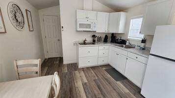 Fridge, microwave, stovetop, cookware/dishes/utensils