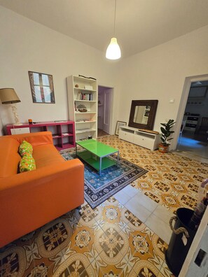 Living area - "Libiam nè lieti calici" dwells at the foot of the Torrazzo dedicated to music.  (Cremona)