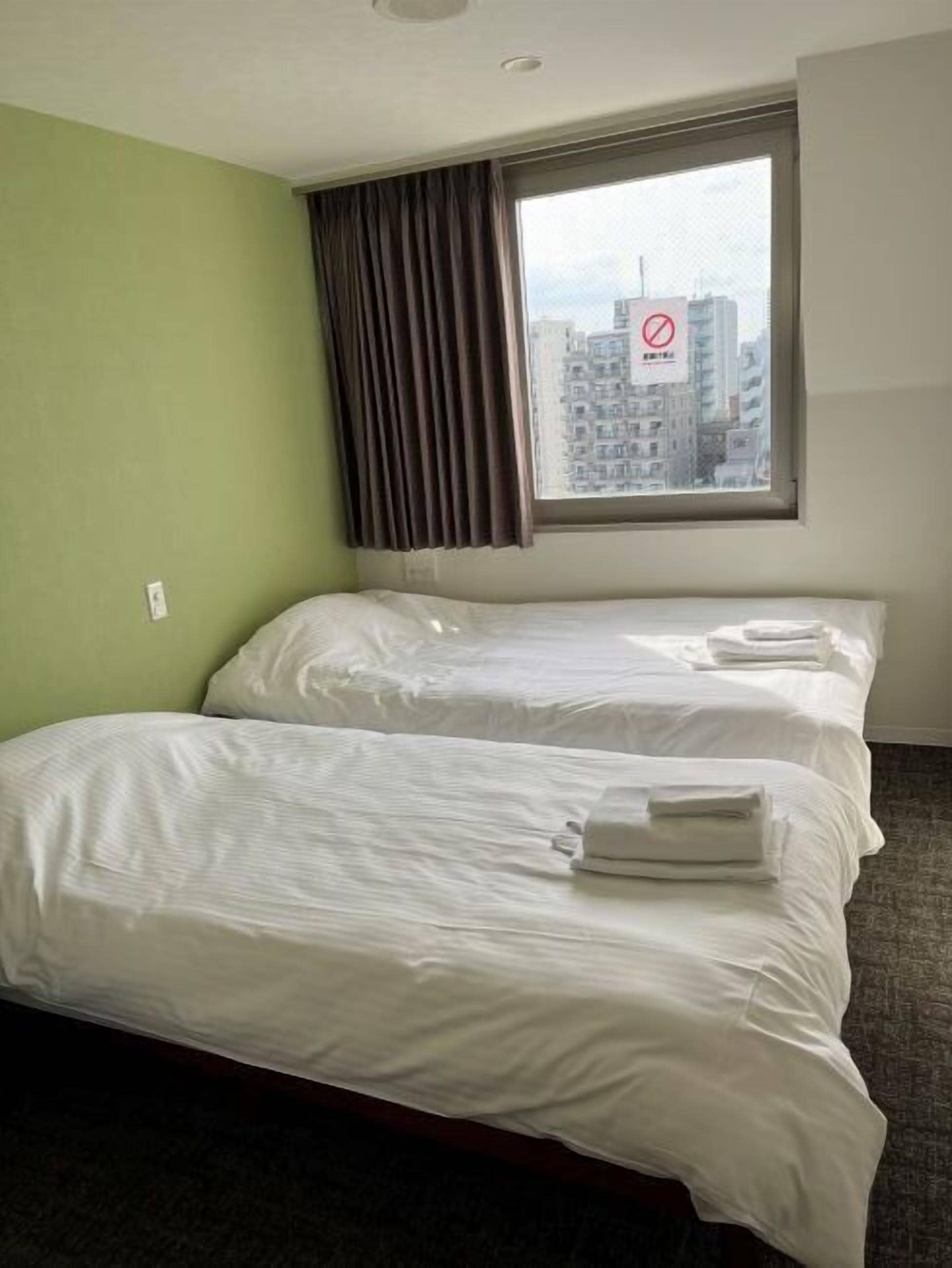 Quarto duplo, para não fumantes (With Bathroom and Toilet) | Wi-Fi de cortesia, roupa de cama