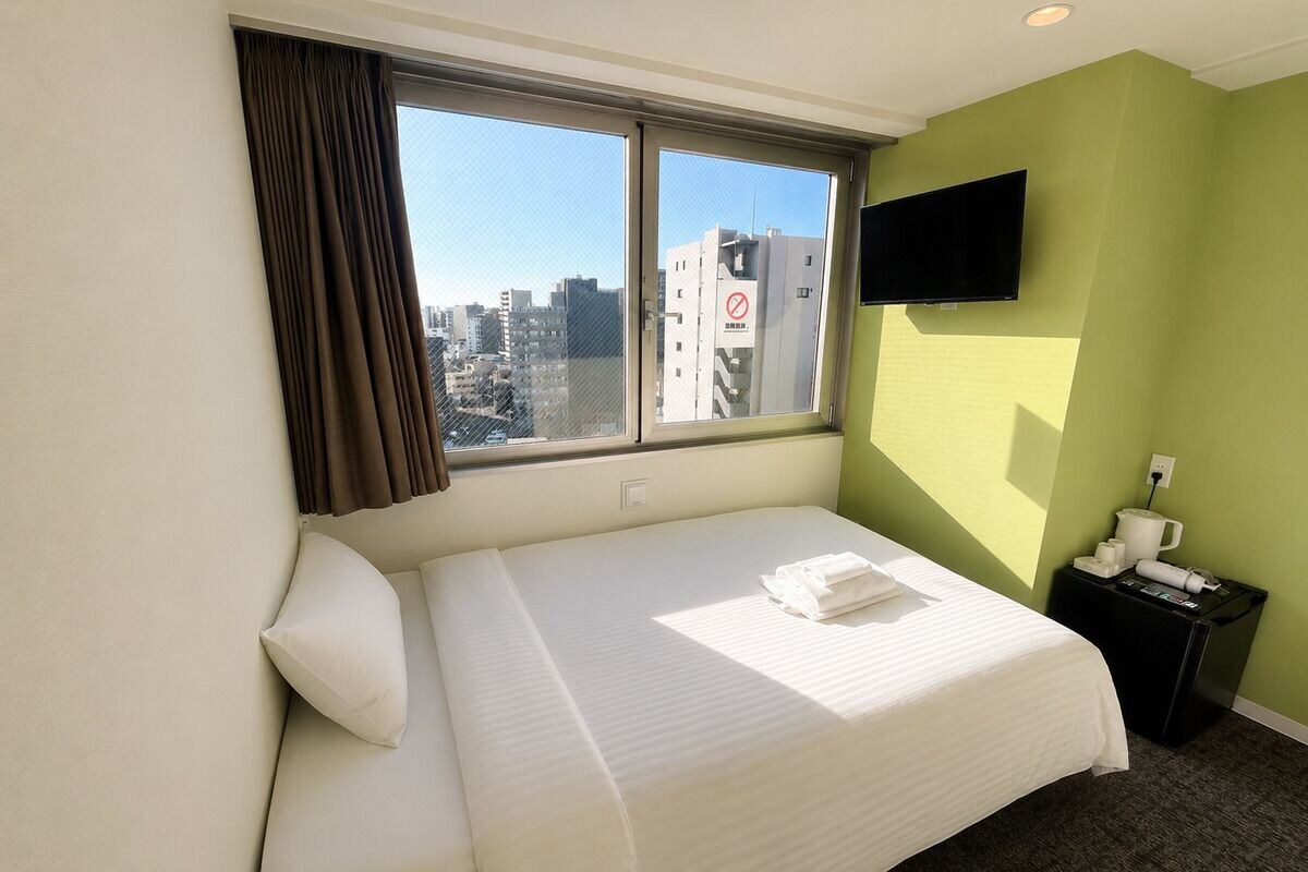 Habitación básica doble, no fumadores (With Bathroom and Toilet) | Wifi gratis y ropa de cama