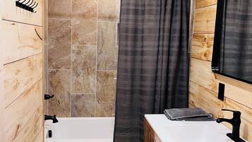 Shower, towels, soap, toilet paper
