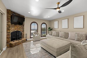 Smart TV, fireplace, books, printers