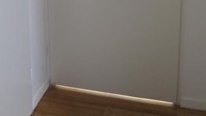 A closed white door with a simple handle.