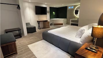 Luxury Suite, Private Bathroom | Desk, laptop workspace, blackout drapes, WiFi (free)