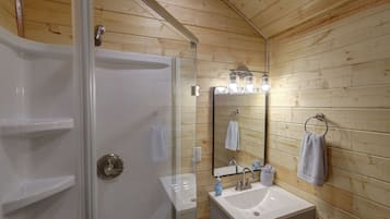 Regadera, toallas, jabón, papel de baño