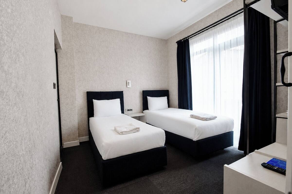 Deluxe Quadruple Room | Premium bedding, minibar, in-room safe, desk