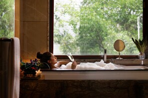 Separate tub and shower, jetted tub, rainfall showerhead
