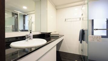 Shower, hair dryer, towels, soap