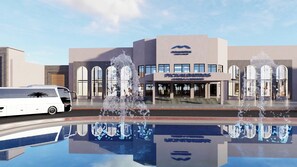 A hotel with a modern facade, a fountain, and a reflection pool. - Albatros Makadi Resort (Makadi Bay)