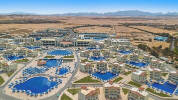 15 outdoor pools, pool umbrellas, sun loungers