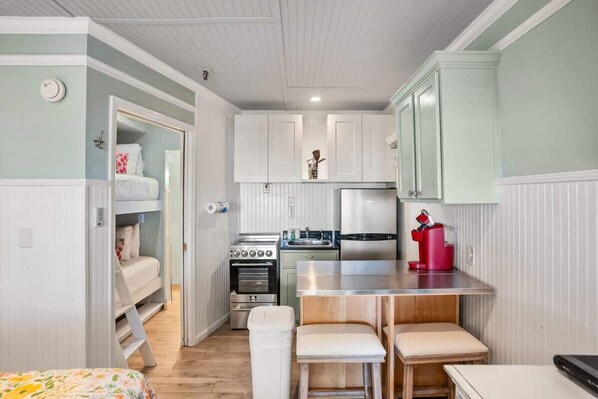 Fridge, microwave, cookware/dishes/utensils