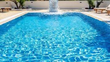 Seasonal outdoor pool, open 8:00 AM to 8:00 PM, sun loungers