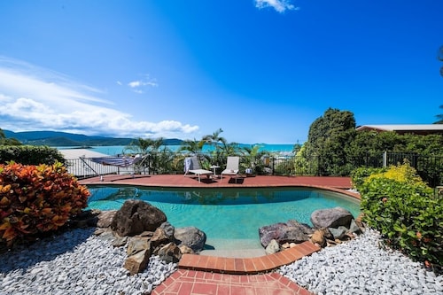 4-bedroom home with a pool and sweeping views of the Coral Sea Marina