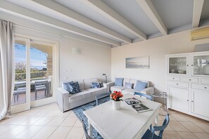 Classic Condo | Living area | 35-cm TV with digital channels