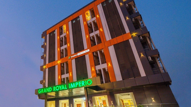 A multi-story hotel with a prominent sign reading "Grand Royal Imperialo". - Treebo Grand Royal Imperio, Hinjewadi (Paud)