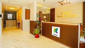 A reception area with a 'Grand Royal Imperio' sign, a reception desk, and a 'treeboo' logo. - Treebo Grand Royal Imperio, Hinjewadi (Paud)