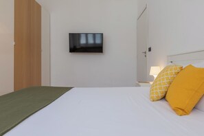 Departamento | 1 habitación, tabla de planchar con plancha, wifi gratis y ropa de cama 