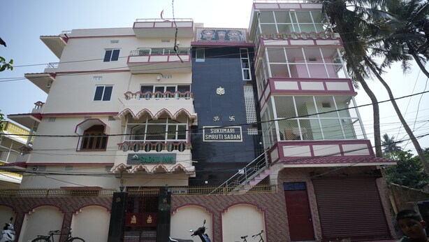 A multi-story building with a sign reading "Sukumari Smruti Sadan". - Sadhu Inn (Puri)