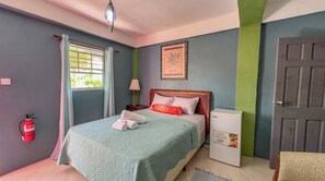 Enjoy a comfortable stay in this well-appointed room featuring a single bed, bedside table, and convenient refrigerator.