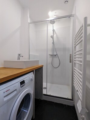 Shower, towels, soap, toilet paper