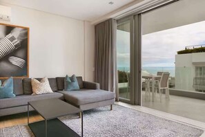 Apartment, Multiple Beds, Patio, Ocean View (Luxury Apartment ) | Living area | 42-inch flat-screen TV with digital channels, fireplace - Deluxe Luxury 2 Bedroom Apartment, Seapoint (Cape Town)