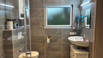 Shower, hair dryer, towels, soap