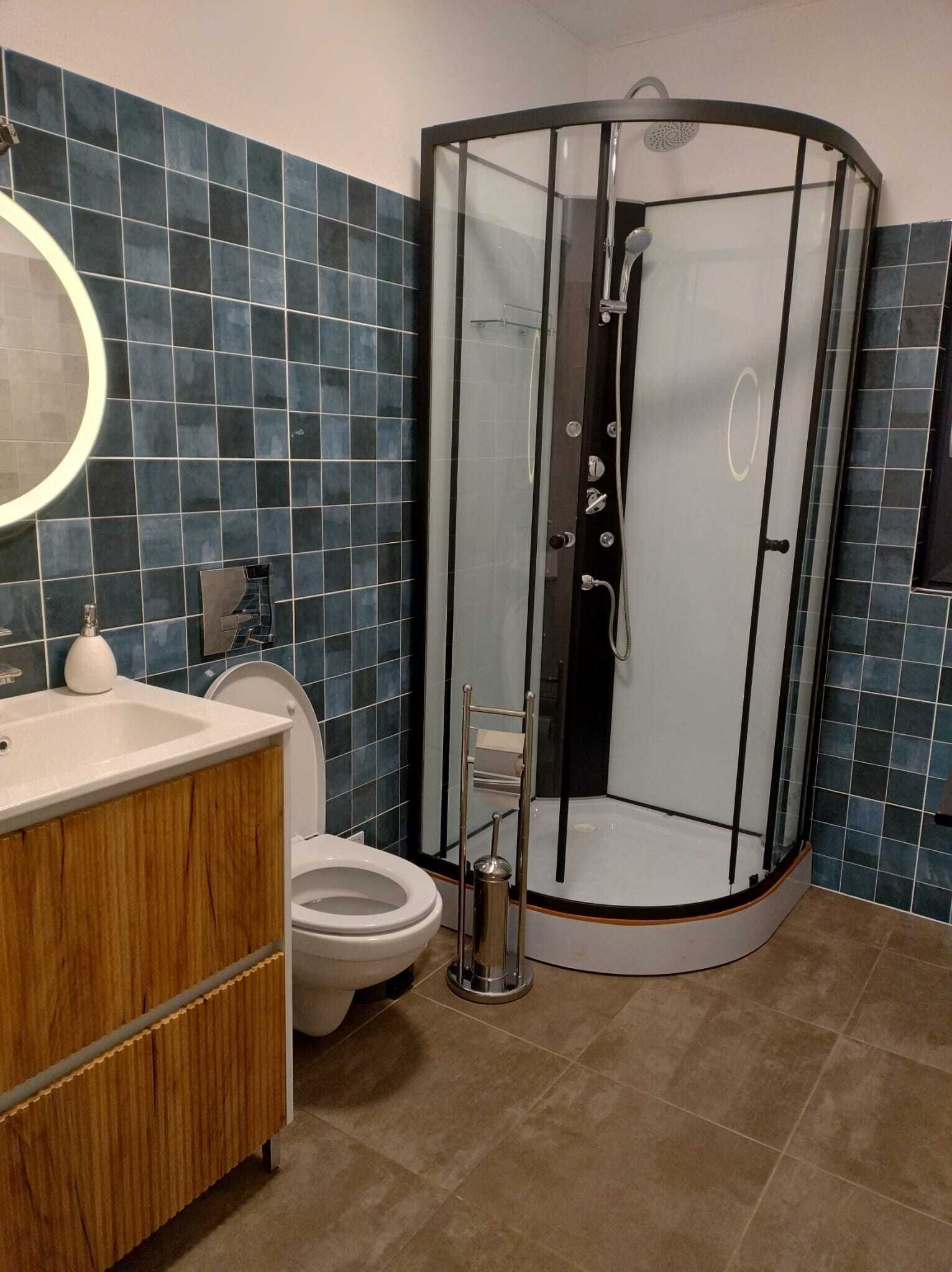Shower, towels, soap, toilet paper