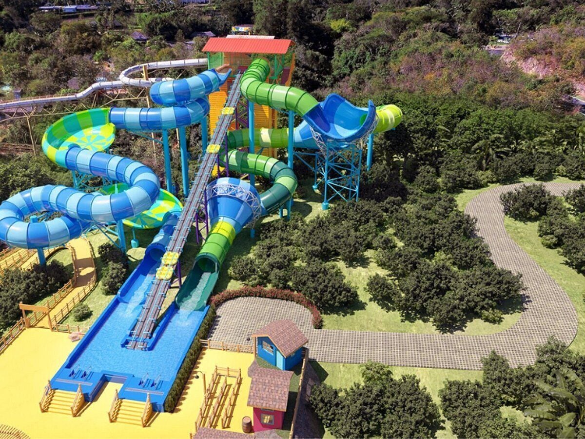 A water park with multiple slides and a long water slide.